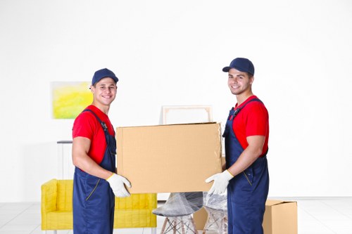 Moving team loading furniture with care in Finchley