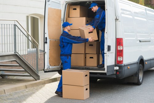 Removal team handling household items during a Finchley move